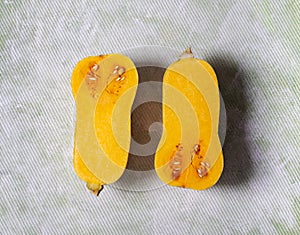 Halves of raw organic butternut squash