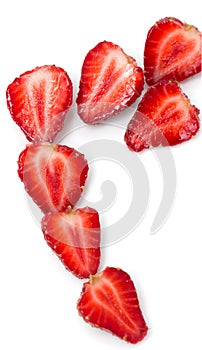 halves of ripe strawberries on a white background