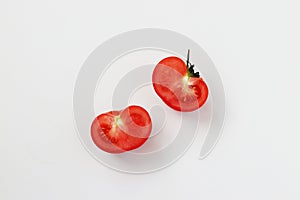 Halves of a tomato isolated on a white backgroundi