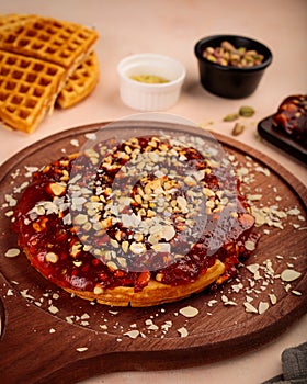 Halwa Waffle with nuts, walnut, almond, pistachio served in dish isolated on table top view of cafe waffles food dessert