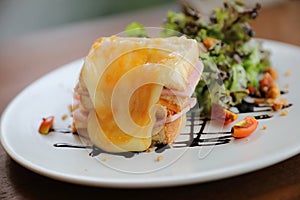 Ham cheese sandwich with salad on a plate