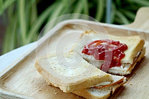 Ham cheese sandwich and tomato ketchup on wood tray and space for write wording,