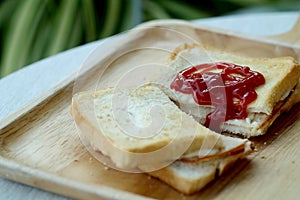 Ham cheese sandwich and tomato ketchup on wood tray and space for write wording,