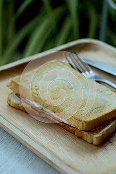 Ham cheese sandwich on wood tray and space for write wording