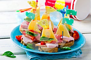 Ham and cheese sandwiches in the form of ships