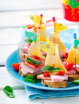 Ham and cheese sandwiches in the form of ships