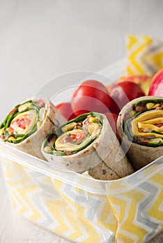 Ham and cheese wraps in lunch box