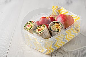 Ham and cheese wraps in lunch box