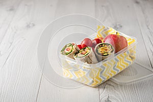 Ham and cheese wraps in lunch box