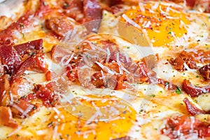 Ham and Eggs Breakfast style pizza on wooden platter