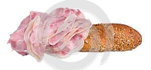 Ham hock slices on baguette with golden baked crust isolated on white background