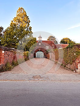 Ham House Stables, a red brick building with curved dutch gable in Richmond, London, England