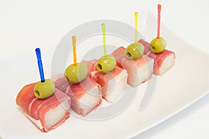Ham with a melon and olives