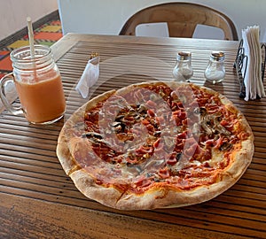 Ham and Mushroom pizza with watermelon drink