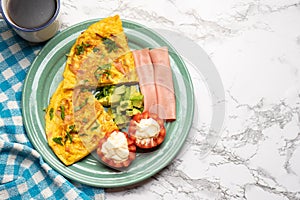 Ham omelette with avocado and tomato