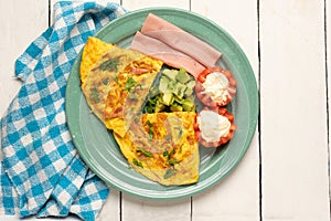 Ham omelette with avocado and tomato