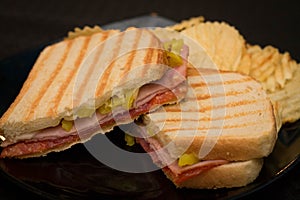 Ham and pastrami panini with ripple chips