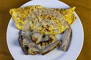 Ham and pepper omlette with sausage and red roasted potatoes