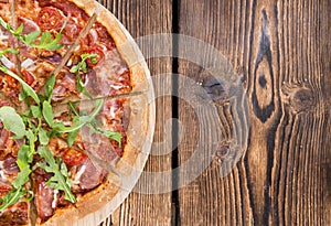 Ham Pizza with rocket and fresh tomatoes