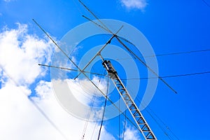 Ham radio antenna against cloudy sky