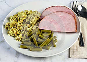 sliced ham, with green beans and stuffing