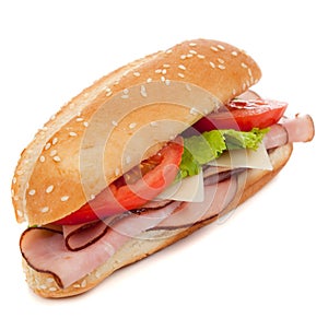 A ham sub sandwich on white