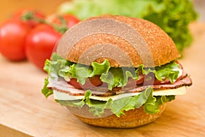 Ham & Swiss sandwich on a cutting board
