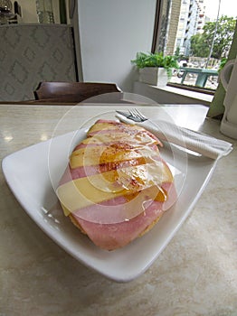 Ham toast with sliced cheese sprinkled with Pimenton de la Vera photo