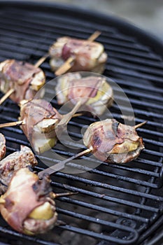 Ham wraped skewers on grill