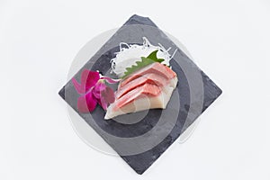 Hamachi Sashimi : Sliced Raw Hamachi Yellowtail Fish Served with Sliced Radish on Stone Plate