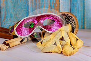 Hamantaschen cookies hamans ears, Purim celebration mask and noisemaker