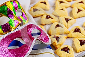Hamantaschen cookies with jam, tallit and mask