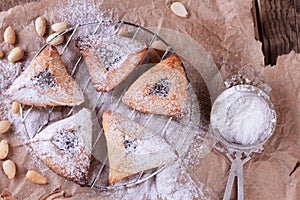 Hamantaschen cookies for Purim with sugar powder