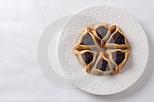 Hamantashen cookies or Aman ears, triangular cookies with poppy seeds