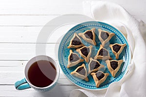 Hamantashen cookies or ears of Haman, triangular cookies with Hamantashen cookies or Aman ears, triangular cookies with poppy seed