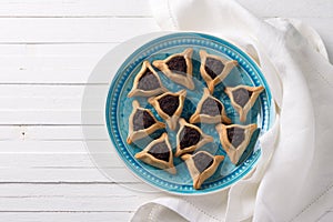 Hamantashen cookies or ears of Haman, triangular cookies with poppy seeds