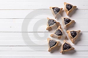 Hamantashen cookies or ears of Haman, triangular cookies with poppy seeds and raisins