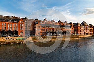 Hamburg downtown. Historic Speicherstadt warehouse district along the canal at sunset. Germany.