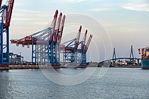 HAMBURG, GERMANY - Aug 08, 2020: Incredible seaside view of the container port in Hamburg at sunset