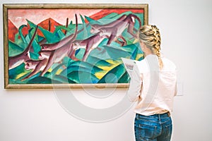 HAMBURG, GERMANY - 9 JULY 2017: Hamburg museum. of art Jung woman admire the painting