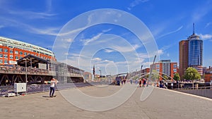 Hamburg, Germany - tourists people having fun at the Hamburg sea port harbor pier on a sunny day in summer