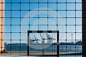 Hamburg port through the glass wall of an office building