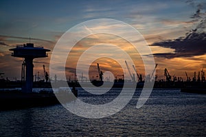 Hamburg port on sunset. Carnes silhouette photo