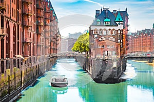 Hamburg Speicherstadt with sightseeing tour boat in summer, Germany photo