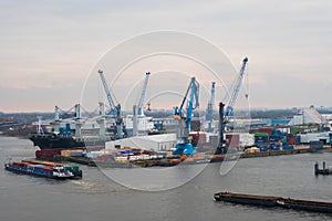 Hamburg. View of the city port with ships and docks, cargo cranes and warehouses