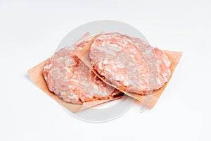 Hamburger with bacon, fast cooking at home. Fast food.Convenience food, precooked.Raw chicken hamburger on a white plate in a