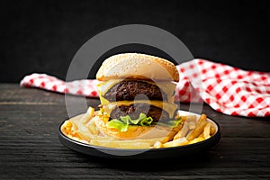 Hamburger or beef burgers with cheese and french fries