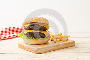 Hamburger or beef burgers with cheese and french fries