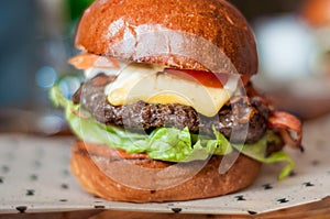 Hamburger with, beef,cheddar, lettuce, bacon and tometoes