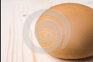 Hamburger bun on a wooden background closeup